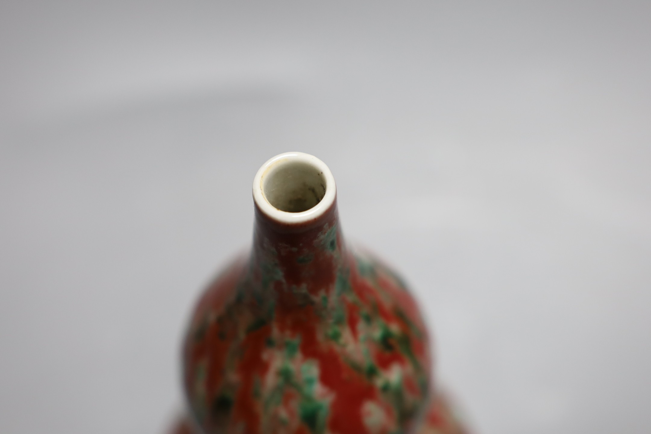 A Chinese flambé double gourd vase, 21 cms high